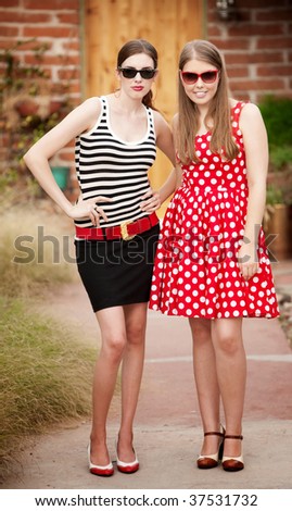 Fashion Girls on Walkway in front of House
