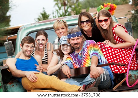 Groovy Group in the Back of Truck Smiling