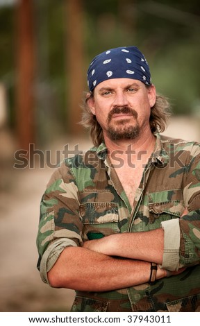 Portrait of rugged man in camouflage jacket