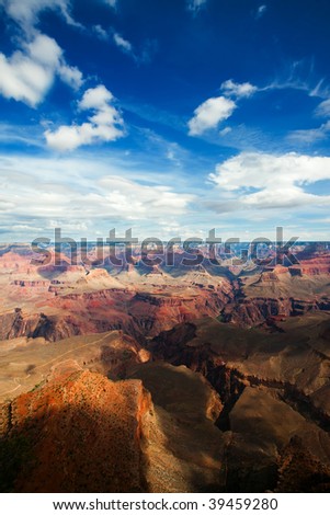 Light and shadow playing on texture of the Grand Canyon featuring Bright Angel Trail