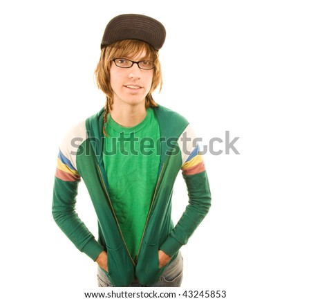 Teenage boy in jacket and ball cap with hands in pockets