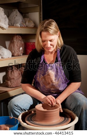 Female Potter at the Wheel in a Clay Studio