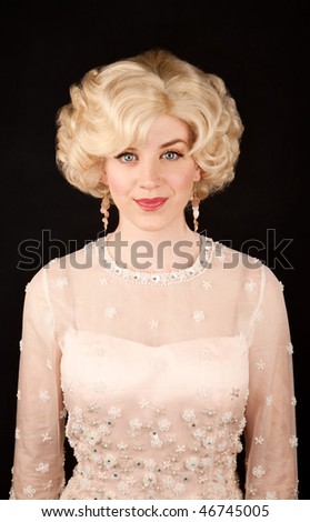 Pretty blonde woman in vintage mid-century dress
