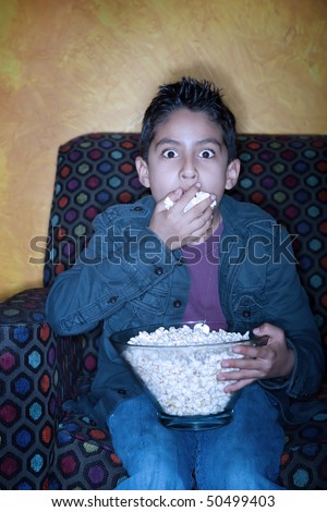 ATU--The Movie, EPISODE I (with epilogue part 1 and 2) -- and EPISODE II -- and EPISODE III -- and EPISODE IV - Page 3 Stock-photo-boy-watching-a-scary-movie-while-eating-popcorn-50499403