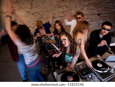 Pretty girl at turntable at a disco music party