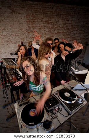 stock photo Cute lady DJ at a 1970s Disco Music Party