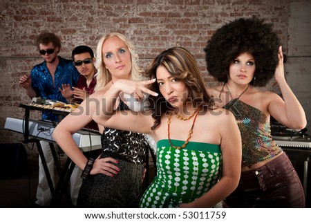 Cute ladies posing at a 1970s Disco Music Party