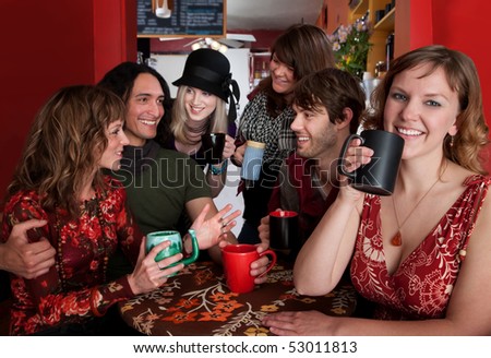 Group of six friends engaged in a social activity