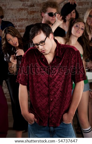 stock photo Nerdy loner at a 1970s Disco Music Party
