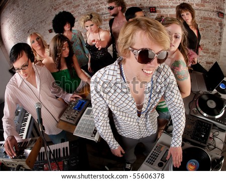 stock photo Record spinning men at a 1970s Disco Music Party