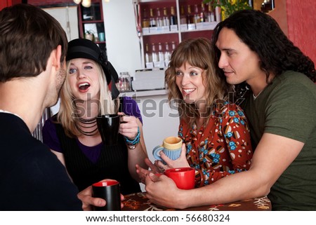 Couples and good friends chat in a cafe