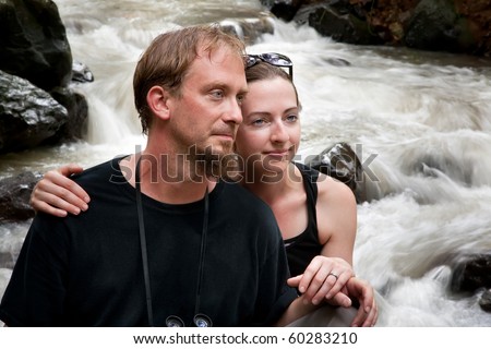 European and American couple in Costa Rica near river