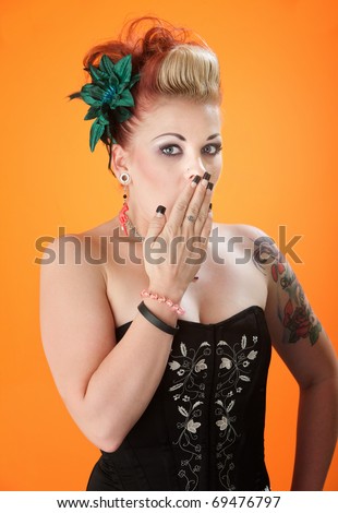 woman with hand on mouth