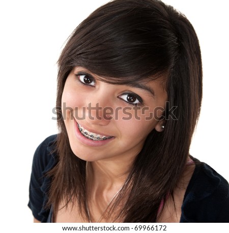 stock photo Cute Latina teenage girl smiling with braces on a white 