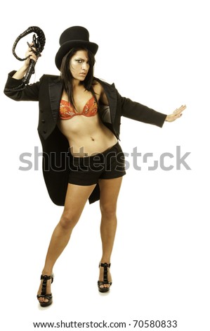 Sexy female lion tamer in circus top hat
