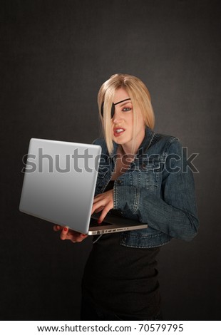 Young lady with eye-patch as a software pirate