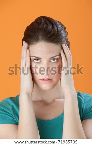 stock photo : Stressed out Caucasian woman massaging her temples with fingers 2011