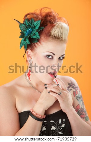 Woman in retro fashion with finger on lips