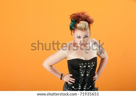 Beautiful young Caucasian woman stares with suspicion
