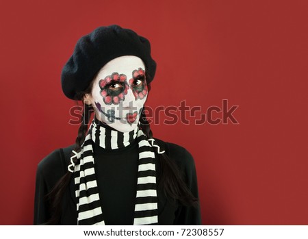 Girl wearing scary makeup for Day of the Dead