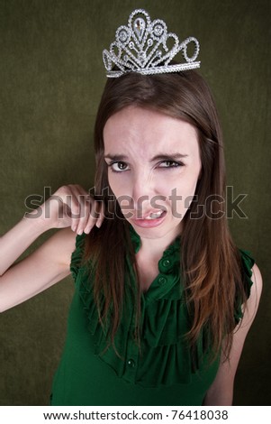Disgusted Young Woman With A Tiara Crown