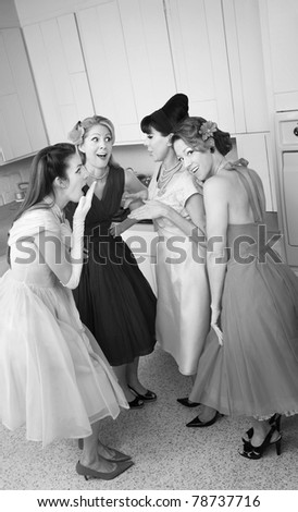 Group of four retro-styled women gossip in a kitchen