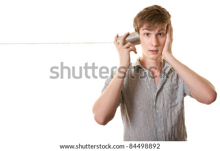 stock photo Skinny Caucasian teen with tin can phone over white background