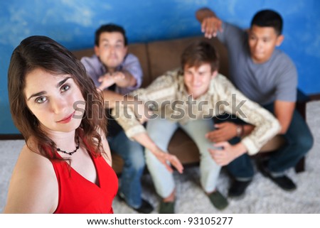 Three men try to reach out for a beautiful young woman