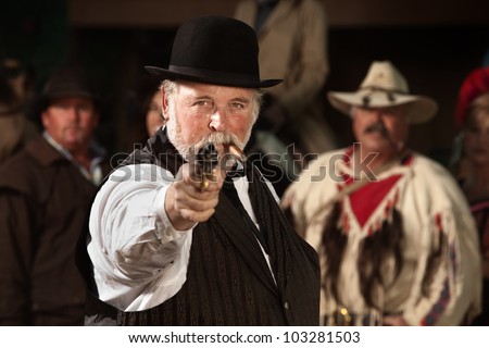 1800s style man in old west theme points his gun