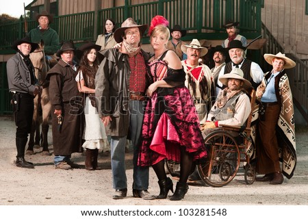 Tough old west gangster with prostitute and group of people