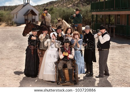 Group of old American west townspeople with weapons