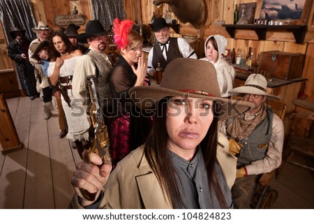 Dangerous woman with gun scares people in old west saloon