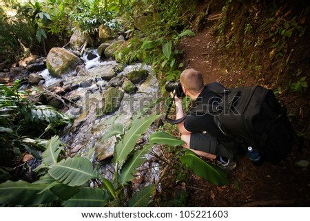 Photographer photographs little stream in a Costa Rican jungle