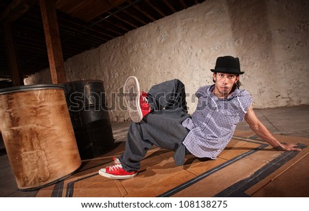 Handsome Mexican man performs break dancing moves
