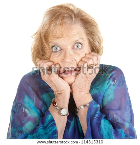 Intimidated older female with wide eyes over white