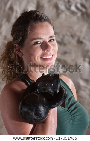 Pretty woman smiling during boot camp workout