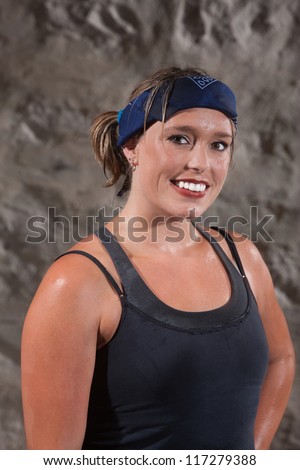 Happy European woman sweating after a boot camp style workout