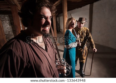 Snarling Caucasian man with tough friends in medieval character