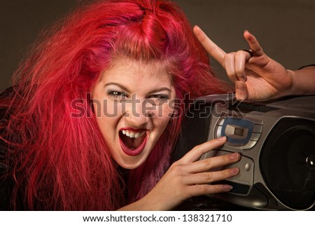 Yelling young woman with pink hair and radio