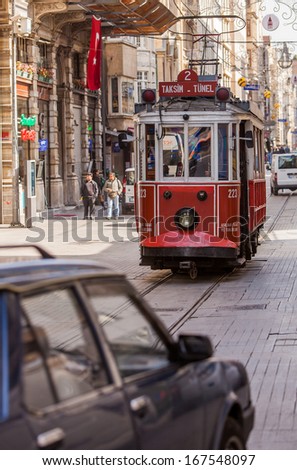 ISTANBUL, TURKEY APRIL 28: Trolley car on busy street on April 28, 2012 in Istanbul, Turkey.  Each year patriotic Turks honor those fallen at the battle of Galipoli during World War I.