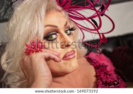 Close up of serious drag queen in blond