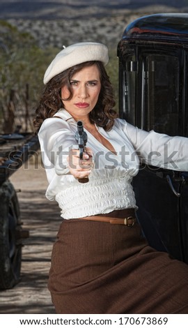 1920s vintage gangster woman aiming pistol