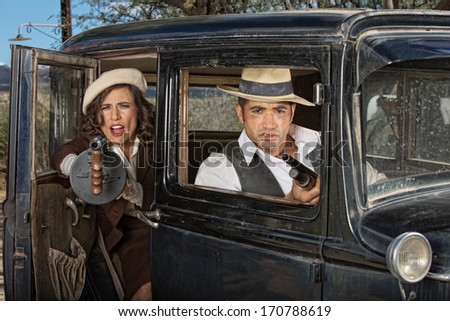 1920s female gangster firing machine gun from car with partner
