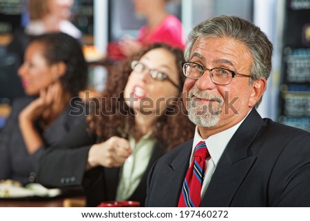 Two arguing business people in coffee house
