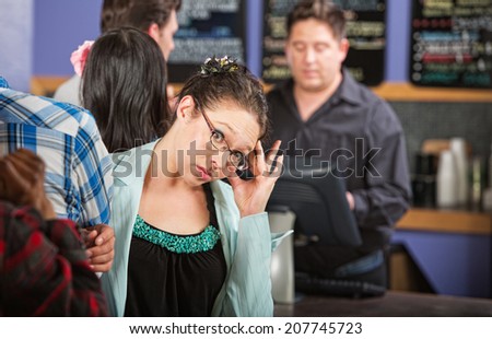 Annoyed cafe customer waiting in line to order
