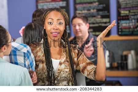 Frustrated female customer with hands up in line
