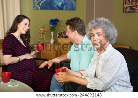 Black man with male partner and pregnant surrogate female