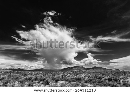 Black and white dramatic monsoon clouds over mountains