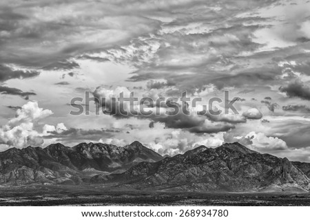 Monsoon clouds forming around arizona  mountain in summer