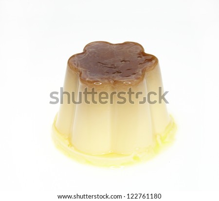 Delicious vanilla custard in caramel sauce isolated on white studio background.